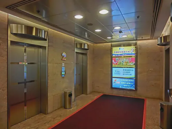 A Raspberry Pi digital signage player in a black case.