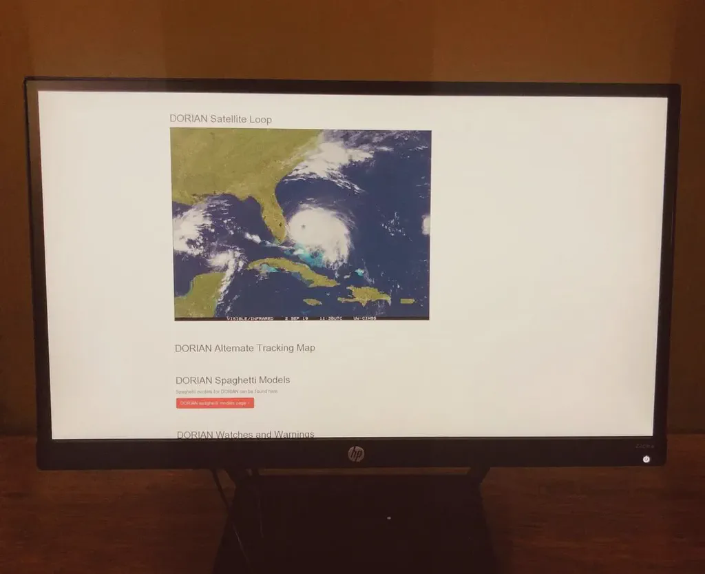A satellite image of Hurricane Dorian displayed on a digital sign.