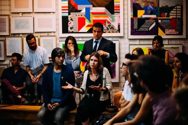 A team at a company meeting struggling with internal communication.