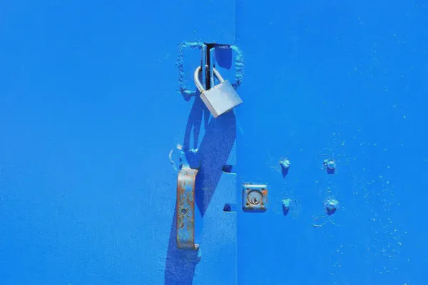 A lock securing a blue window as Screenly secures your digital signage.