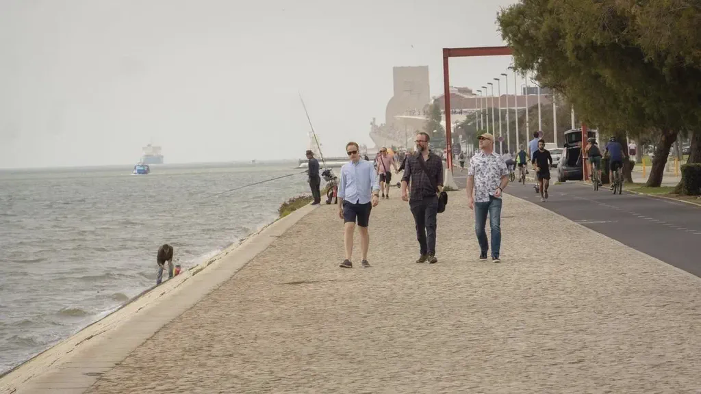 The Screenly team walking along the Tagus River in Lisbon.