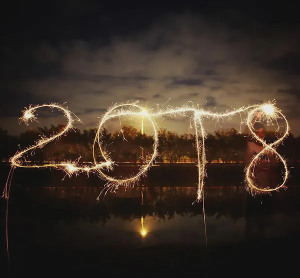 The numbers for 2018 spelled out with fireworks in a time-lapsed photo.