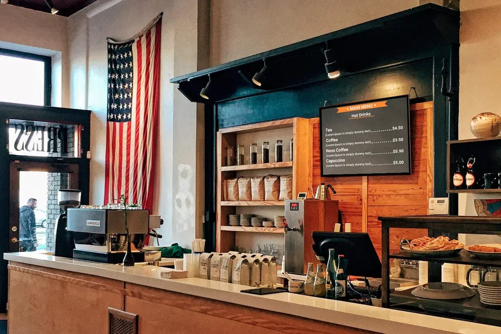 A coffee shop digital sign on display.